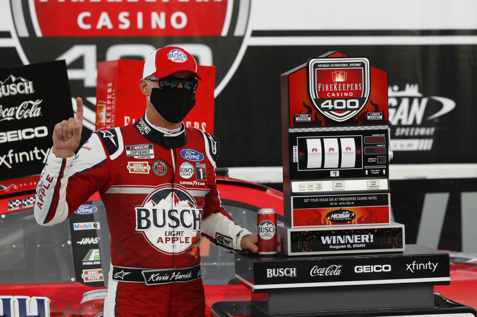 Kevin Harvick celebrates after winning a NASCAR Cup Series auto race at Michigan International Speedway in Brooklyn, Mich., Saturday, Aug. 8, 2020. (AP Photo/Paul Sancya)