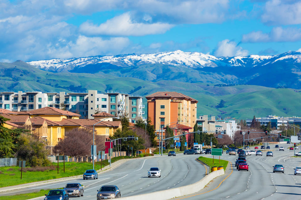 Street of Silicon valley in early spring with snow on top of nearby mountain. San Jose, USA