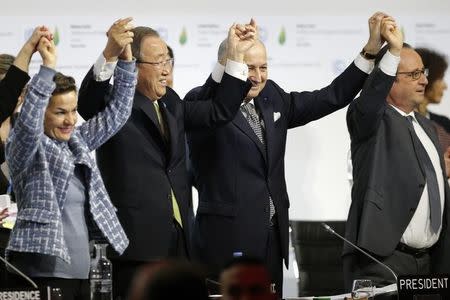 From L-R, Christiana Figueres, Executive Secretary of the UN Framework Convention on Climate Change, United Nations Secretary-General Ban Ki-moon, French Foreign Affairs Minister Laurent Fabius, President-designate of COP21 and French President Francois Hollande react during the final plenary session at the World Climate Change Conference 2015 (COP21) at Le Bourget, near Paris, France, December 12, 2015. REUTERS/Stephane Mahe