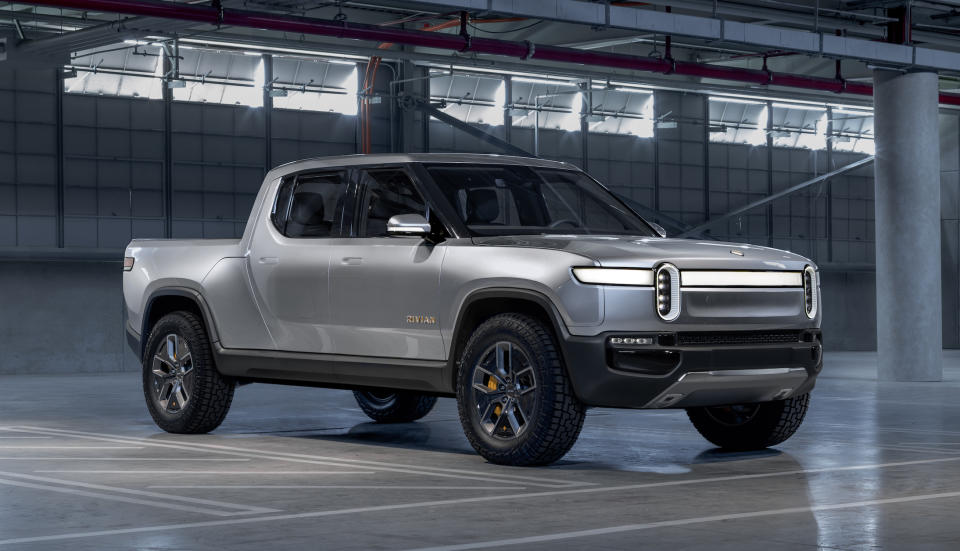 A Rivian R1T, a sleek, futuristic-looking full-size electric pickup truck