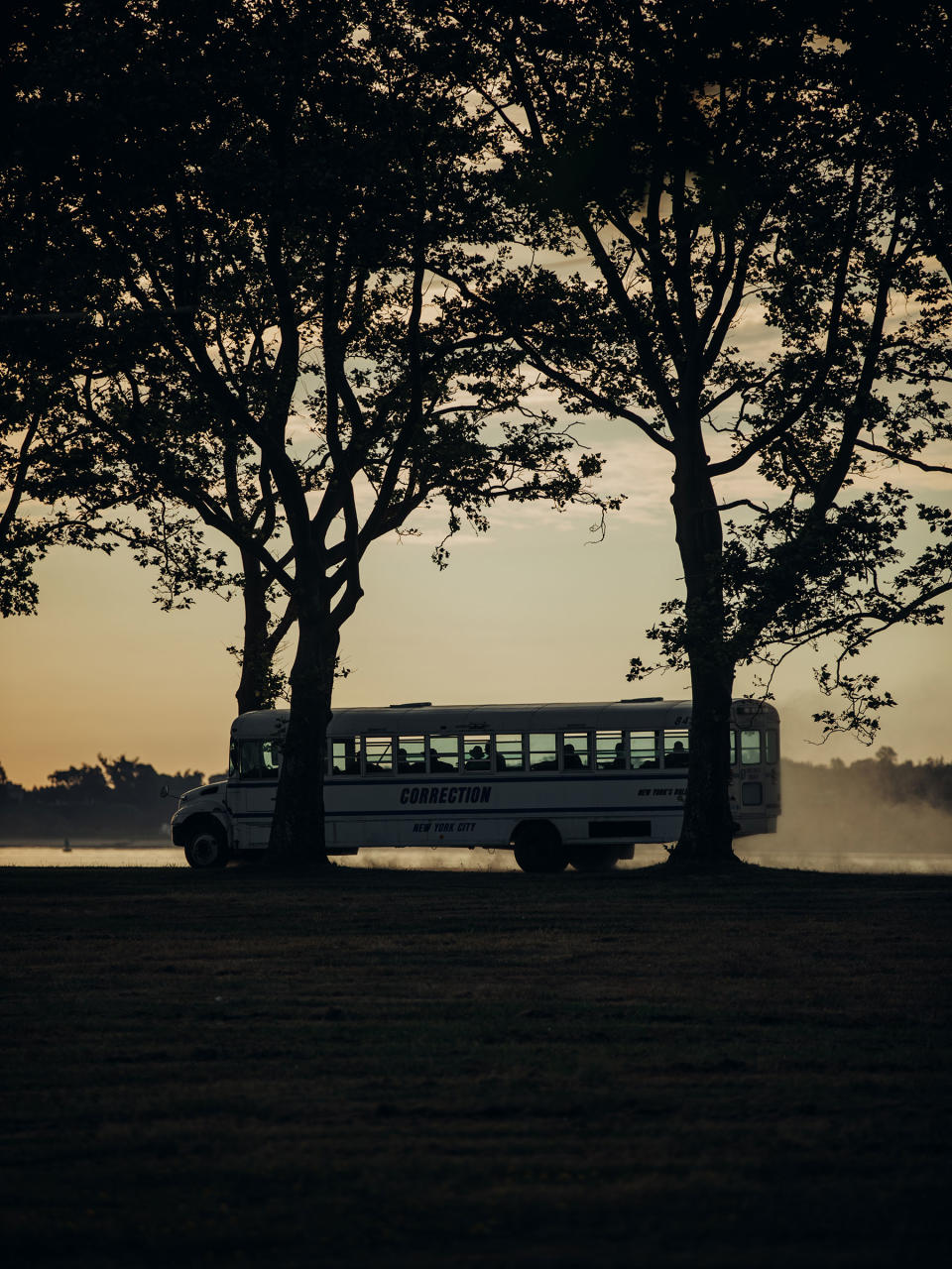 A Department of Correction bus carries workers along Hart Island’s gravel roads.<span class="copyright">Sasha Arutyunova for TIME</span>