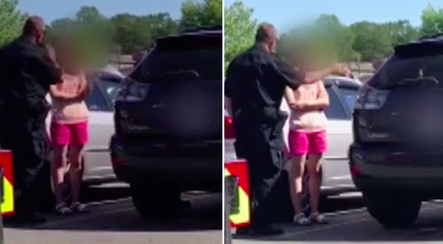 The police officer berated the young next to her car in a car park. Photo: Global BC