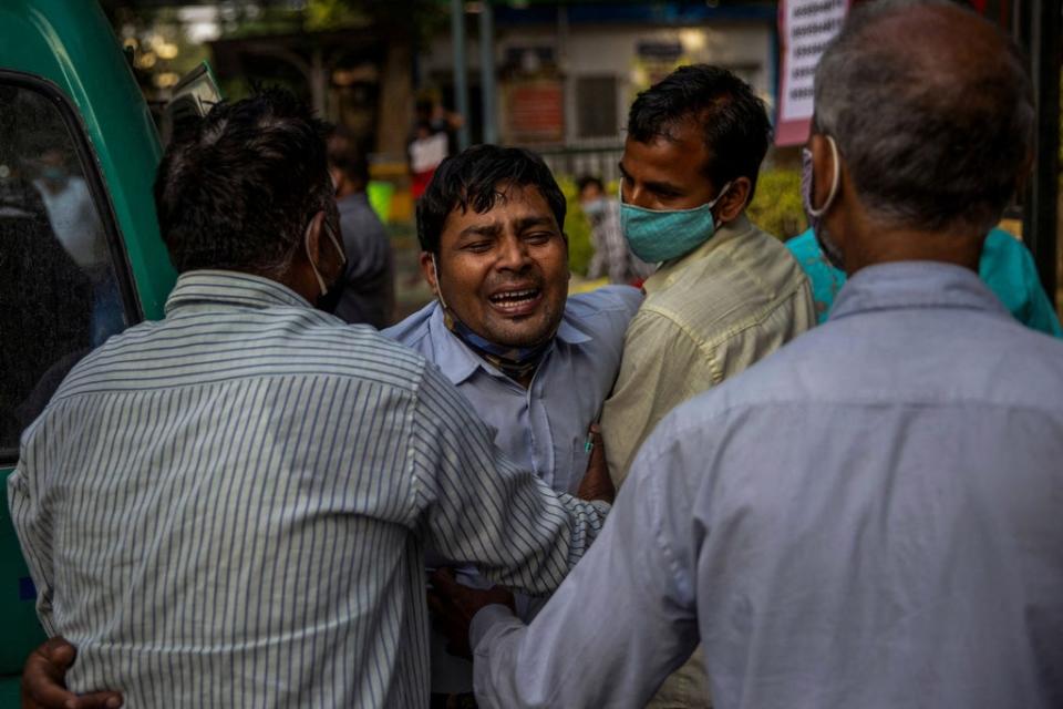 A man grieves as his family member is declared dead outside the coronavirus casualty ward at the Guru Teg Bahadur hospital in New Delhi on 23 April 2021 (Reuters/Danish Siddiqui)