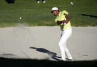 Tony Finau hits his second shot out of the bunker on the 14th hole during a playoff against Max Homa in the final round of the Genesis Invitational golf tournament at Riviera Country Club, Sunday, Feb. 21, 2021, in the Pacific Palisades area of Los Angeles. (AP Photo/Ryan Kang)