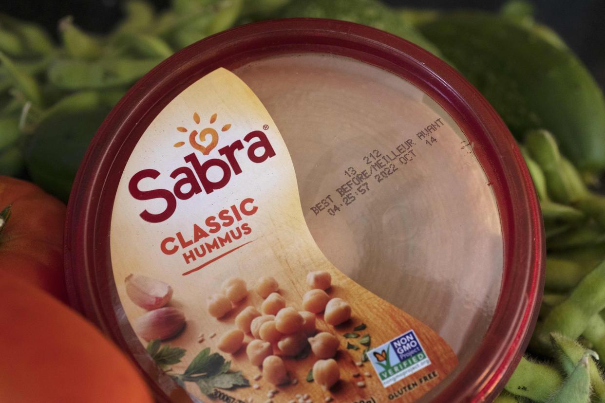 A "best before" date is seen on a container of hummus, Saturday, Aug. 20, 2022, in Boston. As awareness grows around the world about the problem of food waste, one culprit in particular is drawing scrutiny: “best before” labels. Manufacturers have used the labels for decades to estimate peak freshness. Unlike “use by” labels, which are found on perishable foods like meat and dairy, “best before” labels have nothing to do with safety and may encourage consumers to throw away food that’s perfectly fine to eat. (AP Photo/Michael Dwyer)