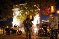 An armed soldier secures a side road near the Champs Elysees Avenue after shooting incident in Paris, France, April 20, 2017. REUTERS/Benoit Tessier