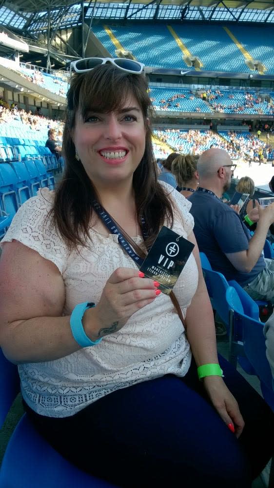 A photo of Denise Taylor sitting in an arena 