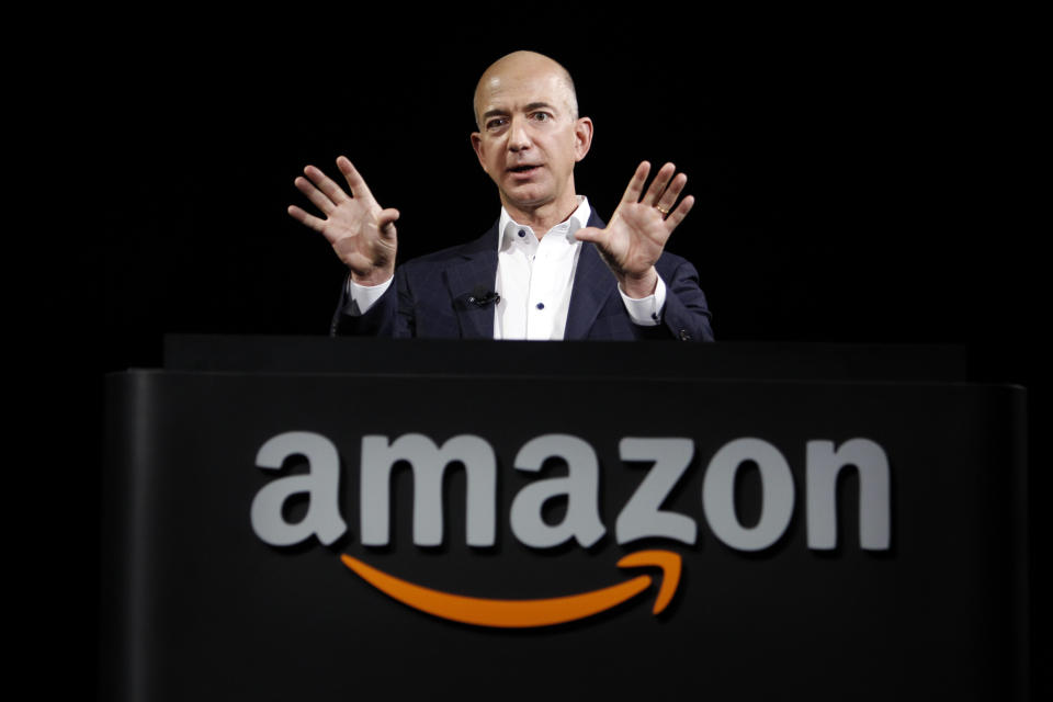 Jeff Bezos, founder of internet giant Amazon, tops the rich list (AP Photo/Reed Saxon)