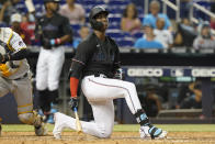 Miami Marlins' Jesus Sanchez slams his bat to the ground after striking out during the ninth inning of the team's baseball game against the Pittsburgh Pirates, Saturday, Sept. 18, 2021, in Miami. The Pirates won 6-3. (AP Photo/Marta Lavandier)