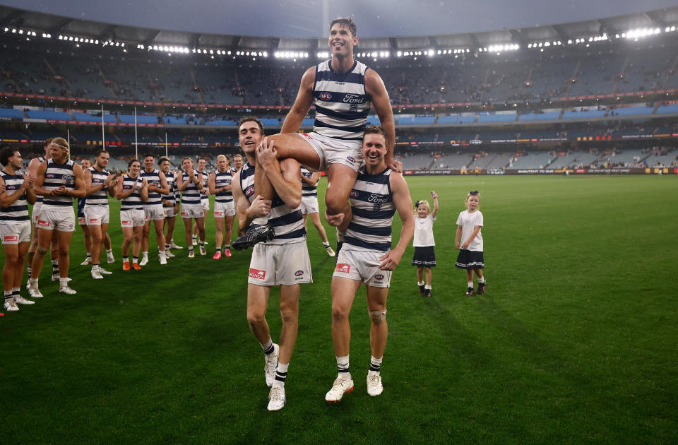 Tom Hawkins, pictured here being chaired off the field by Geelong teammates.