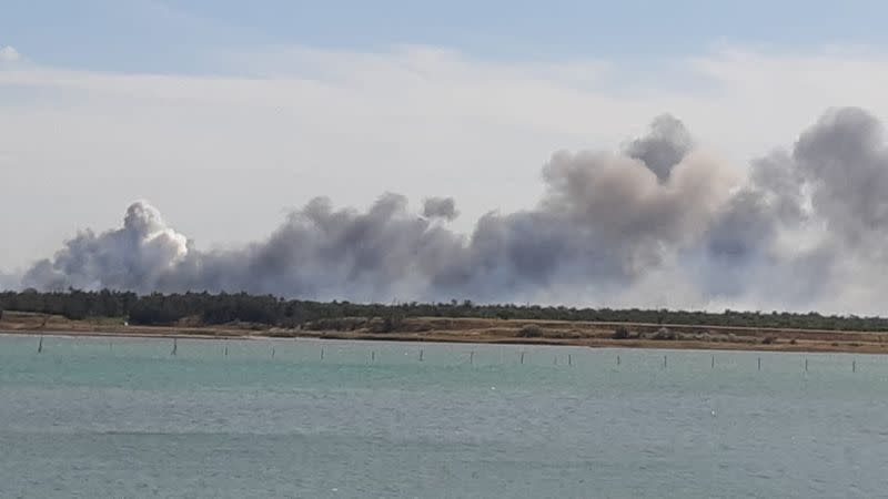 Smoke rises after explosions were heard near Novofedorivka