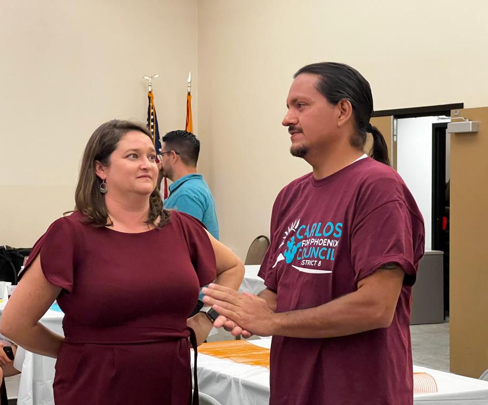 Phoenix City Council candidate Kellen Wilson (left) chats with Councilman Carlos Garcia Nov. 8 after the first batch of early returns was released.