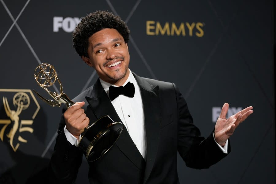 FILE – Trevor Noah, winner of the award for outstanding variety talk series for “The Daily Show With Trevor Noah,” poses in the press room during the 75th Primetime Emmy Awards on Monday, Jan. 15, 2024, in Los Angeles. Noah will host the 2024 Grammy Awards on Feb. 4. (AP Photo/Ashley Landis, File)