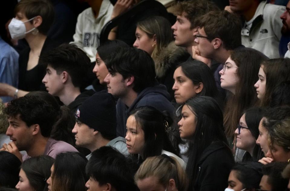 Students and other guests listen as former President Bill Clinton speaks on Tuesday evening.