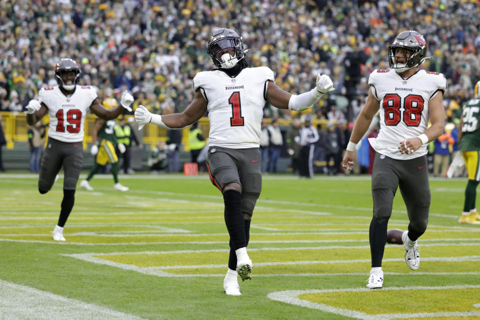 Tampa Bay Buccaneers running back Rachaad White (1) celebrates after catching a 26-yard touchdown pass during the second half of an NFL football game against the Green Bay Packers, Sunday, Dec. 17, 2023, in Green Bay, Wis. (AP Photo/Matt Ludtke)