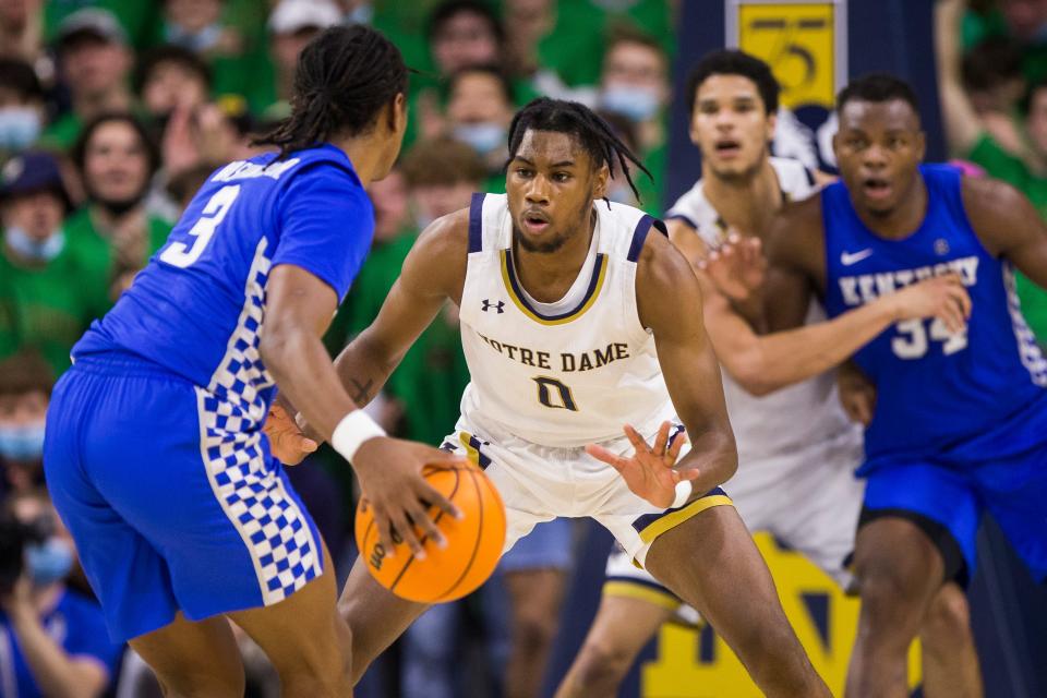 Notre Dame's Blake Wesley (0) guards Kentucky's TyTy Washington Jr. (3) during an NCAA college basketball game on Saturday, Dec. 11, 2021, in South Bend, Ind. (AP Photo/Robert Franklin)