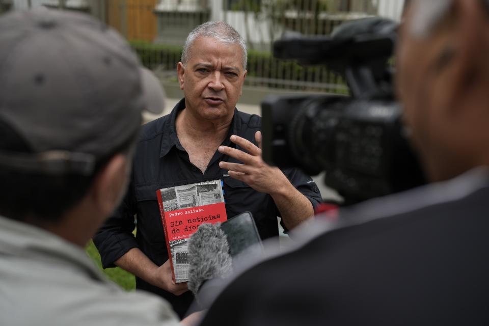 Pedro Salinas speaks with the press outside the Nunciatura Apostolica after meeting with Vatican investigators about alleged abuse by the Catholic lay group Sodalitium Christianae Vitae (SCV) in Lima, Peru, Tuesday, July 25, 2023. Salinas, who personally accuses the SCV of abuse, was a member of the organization when he was a teen and is now is a journalist who has written two books about it. (AP Photo/Martin Mejia)
