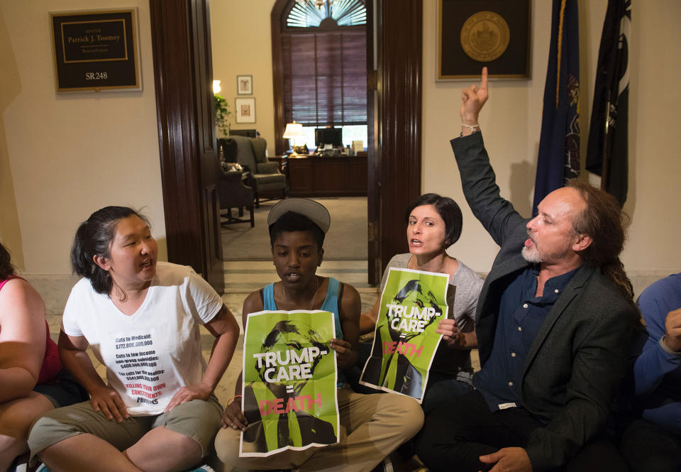 <p>Protesters of the Senate Republicans health care bill stage a sit-in outside the office of Sen. Patrick Toomey, Republican of Pennsylvania, on Capitol Hill in Washington, June 28, 2017. (Photo: Saul Loeb/AFP/Getty Images) </p>