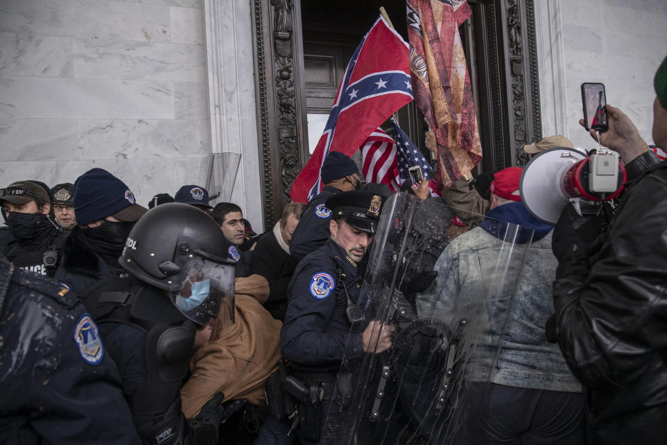 Demonstrators clash with U.S. Capitol police officers while trying to enter the Capitol building during a protest outside of in Washington, D.C. on Wednesday. (Victor J. Blue/Bloomberg via Getty Images)