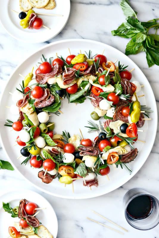 <p>Courtesy of SimplyScratch.com</p><p>SimplyScratch.com recommends adding a small jar of reduced balsamic glaze next to your wreath so people can put a little on their plate or drizzle it over their skewer for a little extra oomph of flavor. </p><p><strong>Get the Recipe: <a href="https://www.simplyscratch.com/2019/12/holiday-antipasto-wreath.html" rel="nofollow noopener" target="_blank" data-ylk="slk:Holiday Antipasto Wreath;elm:context_link;itc:0;sec:content-canvas" class="link ">Holiday Antipasto Wreath</a></strong></p>