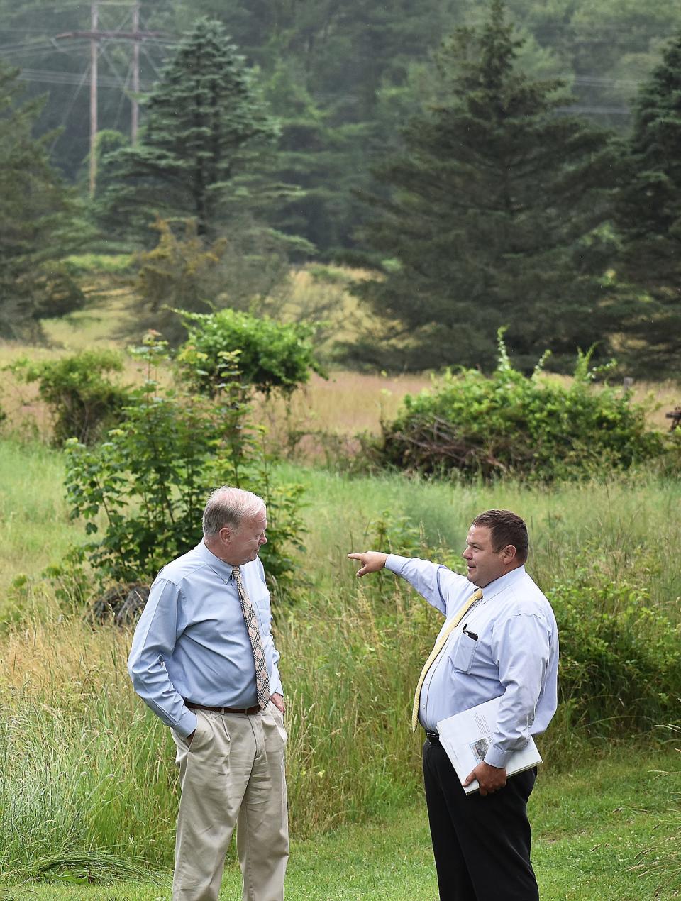 Mayor Paul Coogan talks with Public Utilities administrator Paul Ferland on the farm that will be developed into an education center for land preservation.
(Credit: Colin Furze)