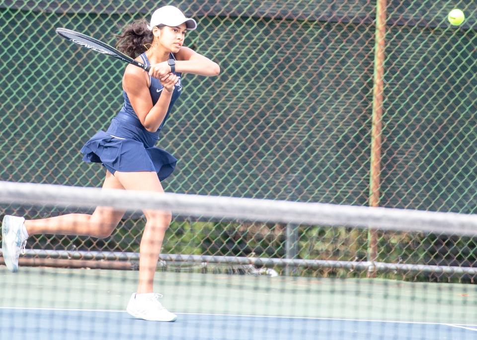 Dallastown's Namya Jindal follows through on a shot to New Oxford's Anya Rosenbach in their No. 1 singles match on Friday, Sept. 22, 2023.
