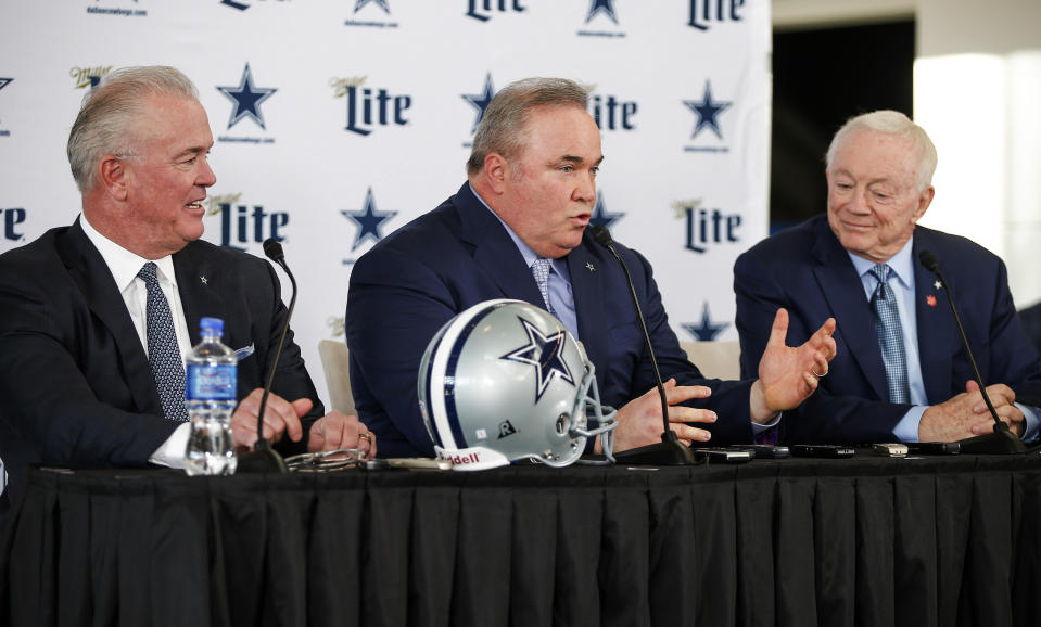 New Dallas Cowboys head coach Mike McCarthy, center, is introduced by Chief Operating Officer Stephen Jones, left, and owner Jerry Jones, right, during a press conference at the Dallas Cowboys headquarters Wednesday, Jan. 8, 2020, in Frisco, Texas. (AP Photo/Brandon Wade)