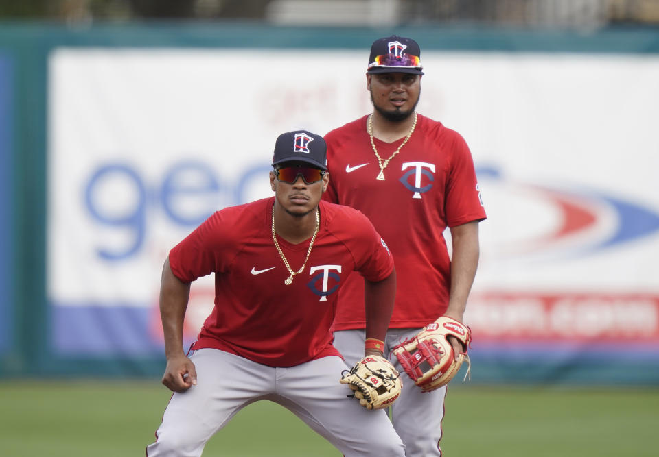 Minnesota Twins shortstop Jorge Polanco, left, and second baseman Luis Arraez are shown during spring training baseball practice on Wednesday, Feb. 24, 2021, in Fort Myers, Fla. (AP Photo/Brynn Anderson)