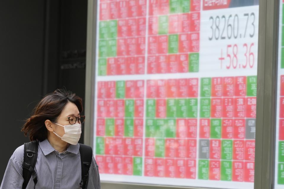 A person looks at an electronic stock board showing Japan's Nikkei 225 index at a securities firm Thursday, May 9, 2024, in Tokyo. (AP Photo/Eugene Hoshiko)