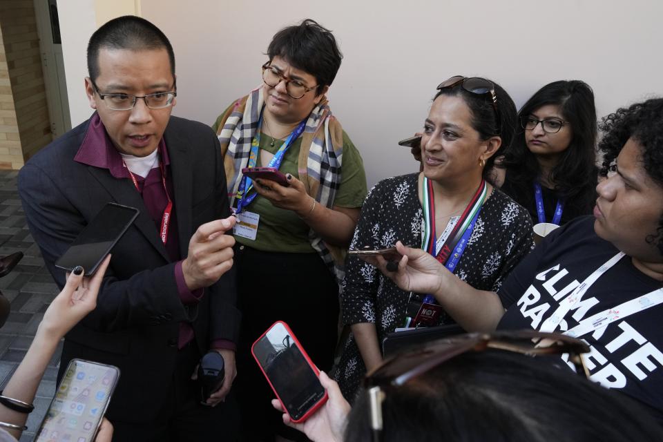 Brandon Wu, left, of ActionAid USA, and Rachel Cleetus, the Union of Concerned Scientists, speak to members of the media at the COP28 U.N. Climate Summit, Sunday, Dec. 10, 2023, in Dubai, United Arab Emirates. (AP Photo/Peter Dejong)