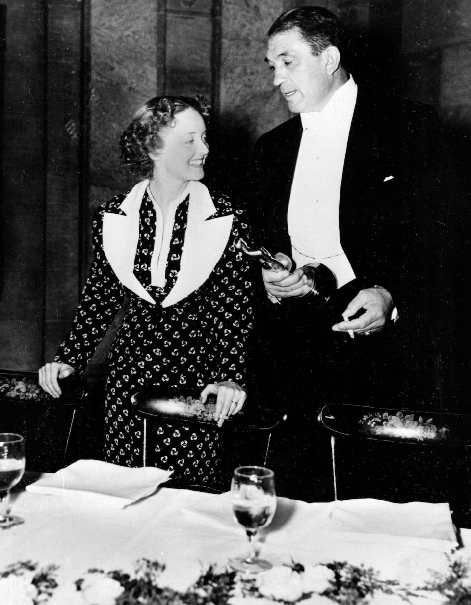 Bette Davis and Victor McLaglen are shown after winning their Oscars at the 1935 Academy Awards banquet held at the Biltmore Bowl, Biltmore Hotel in Los Angeles, Ca., on March 5, 1936