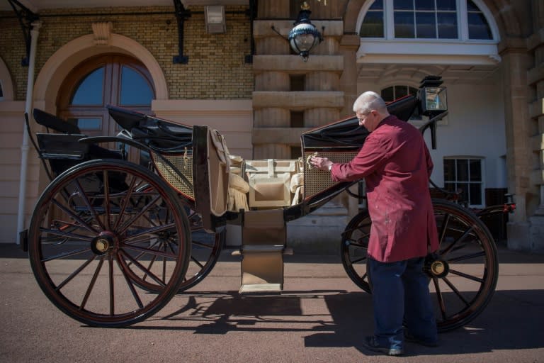 Senior Carriage Restorer, Martin Oates polishes the Ascot Landau carriage that will carry Britain's newly wed royal couple after their marriage ceremony