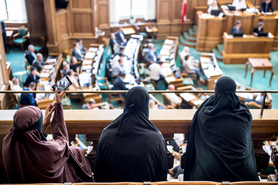 <span>Women in niqabs in the audience listen to the Danish Parliament at Christiansborg Castle in Copenhagen, Denmark. Photo: </span>AAP