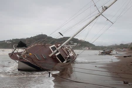 A damaged boat is pictured on the shore of San Juan del Sur Bay after tropical storm Nate in San Juan del Sur, Nicaragua October 6,2017.REUTERS/Oswaldo Rivas