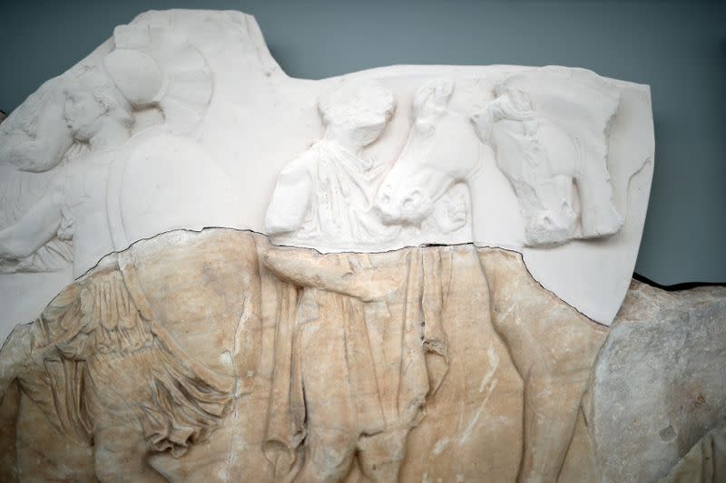 An original sculpture from the Parthenon frieze temple is seen partially reconstructed by plaster, at the Parthenon Gallery of the Acropolis Museum, in Athens