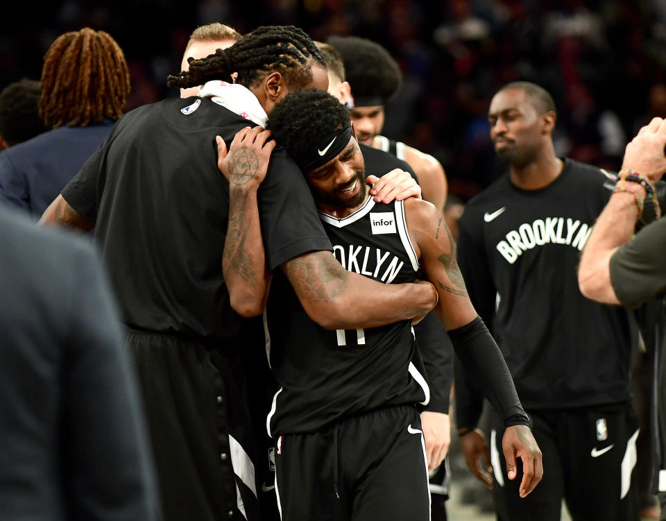 NEW YORK, NEW YORK - OCTOBER 23: DeAndre Jordan #6 hugs Kyrie Irving #11 of the Brooklyn Nets after their 127-126 loss to the Minnesota Timberwolves at Barclays Center on October 23, 2019 in the Brooklyn borough of New York City. NOTE TO USER: User expressly acknowledges and agrees that, by downloading and or using this photograph, User is consenting to the terms and conditions of the Getty Images License Agreement. (Photo by Emilee Chinn/Getty Images)