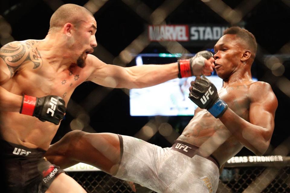 Robert Whittaker (left) dropped the middleweight strap to Israel Adesanya in 2019 (AFP via Getty Images)