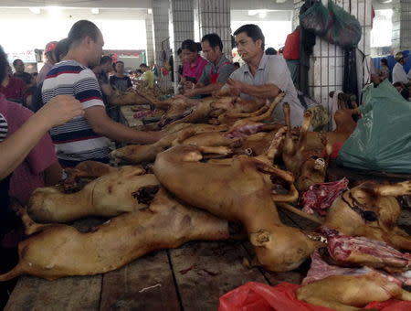Vendors sell dog meat at a dog meat market on the day of local dog meat festival in Yulin, Guangxi Autonomous Region, June 22, 2015. REUTERS/Kim Kyung-Hoon