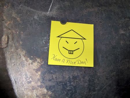 A note with a caption "Have a nice day" left on an opening in the pipe, where two inmates are suspected to have cut open as part of their escape from Clinton Correctional Facility in Dannemora, New York, is seen in this New York Governor's Press Office handout photo taken June 6, 2015 and released on June 7, 2015. REUTERS/New York Governor's Press Office/Handout via Reuters