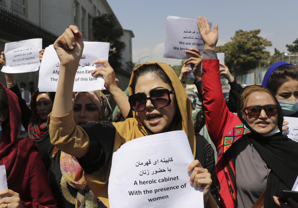 Women gather to demand their rights under the Taliban rule during a protest in Kabul, Afghanistan, Friday, Sept. 3, 2021. As the world watches intently for clues on how the Taliban will govern, their treatment of the media will be a key indicator, along with their policies toward women. When they ruled Afghanistan between 1996-2001, they enforced a harsh interpretation of Islam, barring girls and women from schools and public life, and brutally suppressing dissent. (AP Photo/Wali Sabawoon)