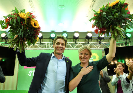 Katharina Schulze and Ludwig Hartmann top candidates of the Green Party react after the announcement of first exit polls in the Bavarian state elections in Munich, Germany, October 14, 2018. REUTERS/Andreas Gebert