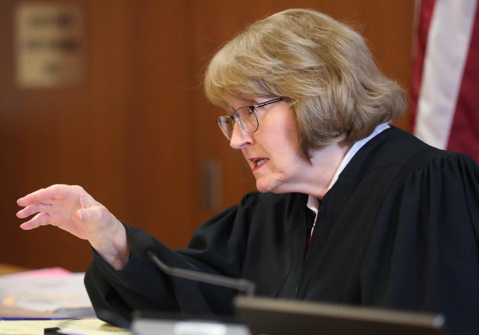 Visiting Judge Patricia Cosgrove is overseeing debt collection cases brought against former Copley basketball coach Mark Dente.