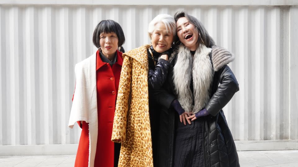 Models (from left) Yun Mi-young, 58, Choi Soon-hea, 80, and Kang Seun-hee, 64, on the first day of Seoul Fashion Week. “Because of the cold weather, we didn’t get to show off much," said Kang. "But we tried our best to dress like models.” - Soeun Kim/CNN