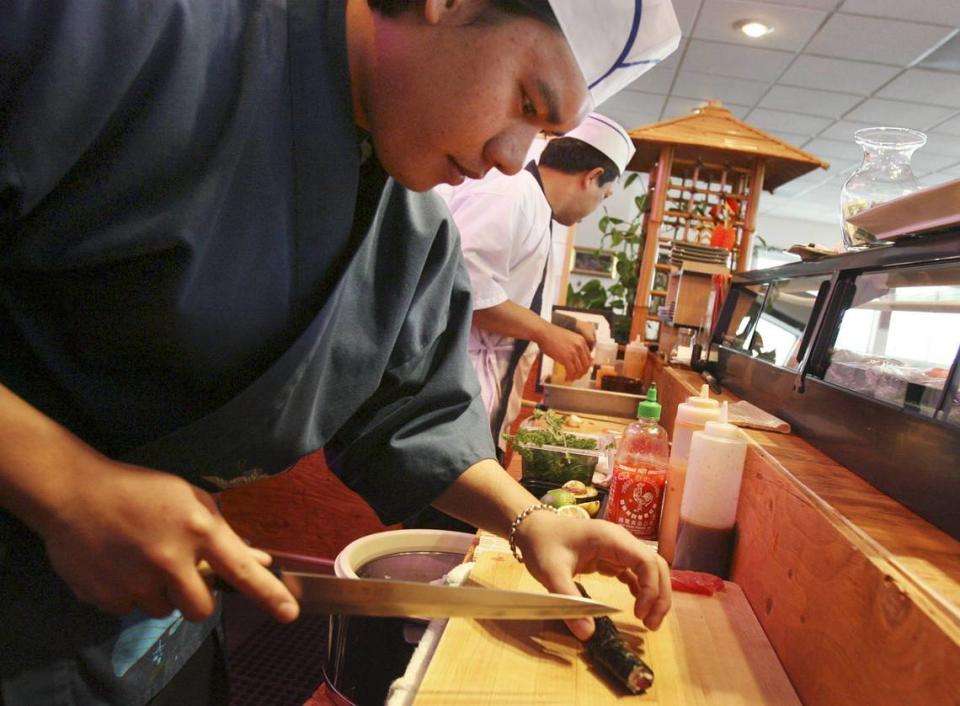 In this 2007 file photo, sushi chefs work at Krung Thai restaurant on Garrity Road in Nampa.