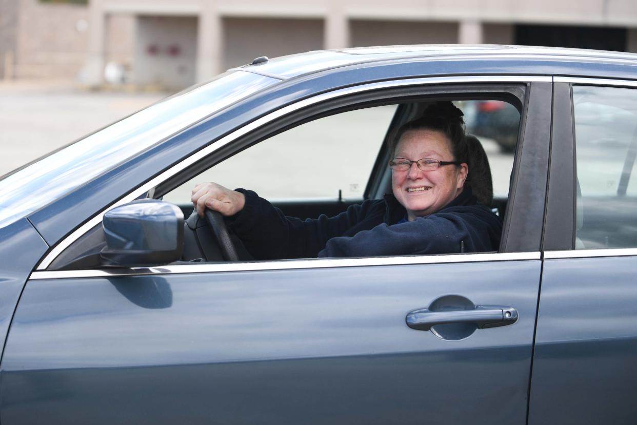 Katrina Newlin sits inside her donated car from Goodwill's Wheels-to-Work program in Lexington, Tenn., on Wednesday, April 3, 2024.