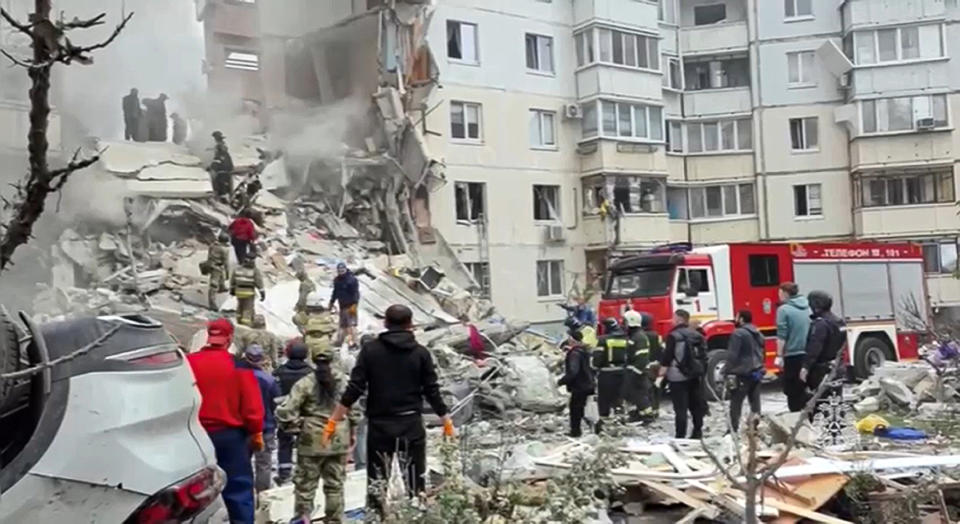 In this photo taken from video released by the Russian Emergency Ministry Press Service on Sunday, May 12, 2024, Russian emergency services work at the scene of a partially collapsed block of flats authorities said was hit during an attack by Ukrainian shelling, in Belgorod, Russia. (Russian Emergency Ministry Press Service via AP)