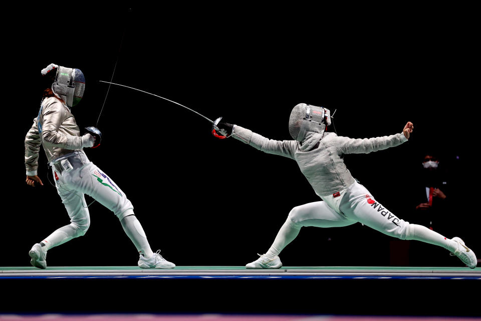 <p>Zaynab Dayibekova of Team Uzbekistan, left, competes against Chika Aoki of Team Japan Women's Sabre Individual first round on day three of the Tokyo 2020 Olympic Games at Makuhari Messe on July 26, 2021 in Chiba, Japan. (Photo by Elsa/Getty Images)</p> 