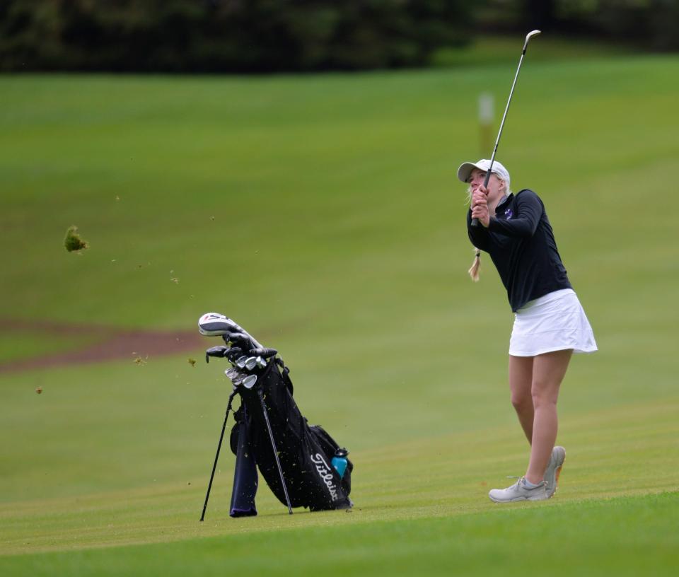 Albany's Abby Thelen follows through on her shot as the girls golfers competed at the St. Cloud Country Club on Thursday, May 12, 2022.  
