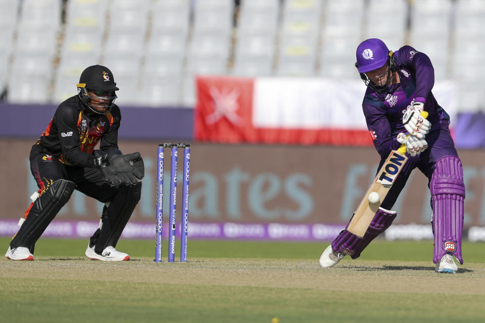 Scotland's Richie Berrington hits the ball during the Cricket Twenty20 World Cup first round match between Scotland and Papua New Guinea in Muscat, Oman, Tuesday, Oct. 19, 2021. (AP Photo/Kamran Jebreili)