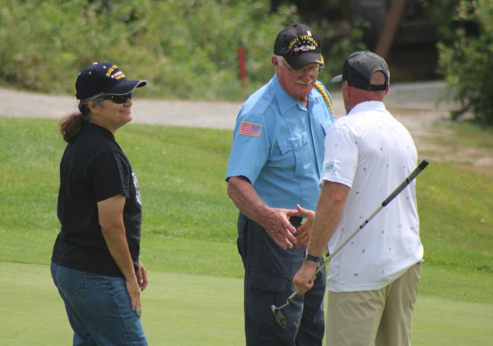 Cheboygan local Vietnam veterans were once again on hand to tend the flag for golfers at the 18th hole during Sunday's final round of the Northern Michigan Open.